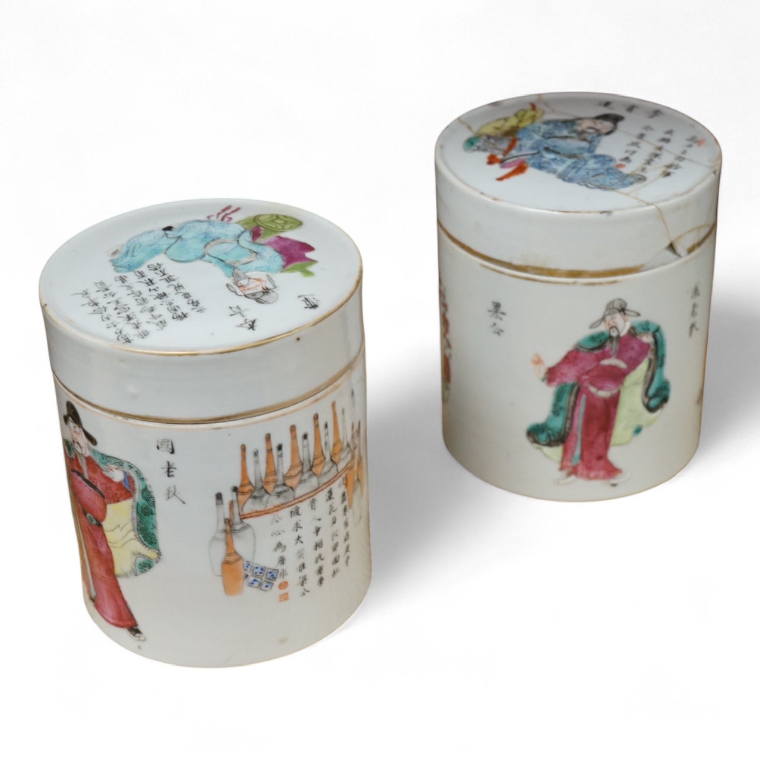 Two mid-19th century Chinese famille rose cylindrical jars and covers, enamelled with figures and calligraphy, 12cm high